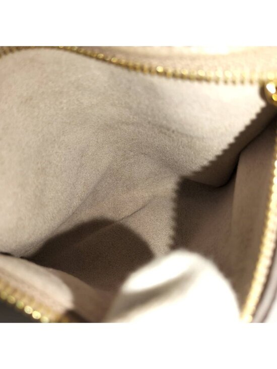 Louis Vuitton Tiny Backpack Monogram Empreinte Beige